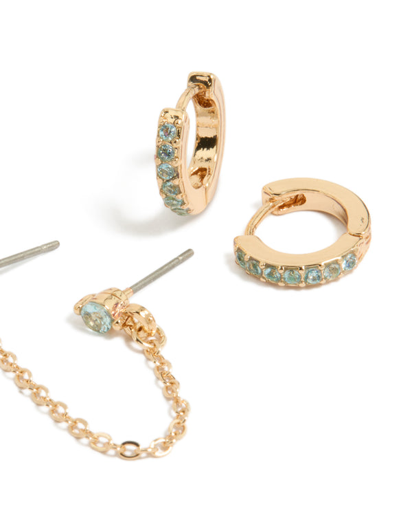 Elegant pack displaying floral huggie earrings featuring chain with light blue cubic zirconia stones in gold close up view