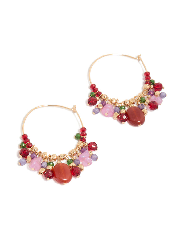 Showcase a pair of statement hoop earrings featuring beads and charms in gold, red, pink, and green tones front view
