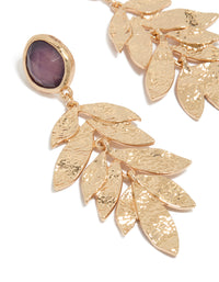 Showcasing statement drop earrings with floral textured layered petals, beads in purple crafted from gold close up view - link has visual effect only