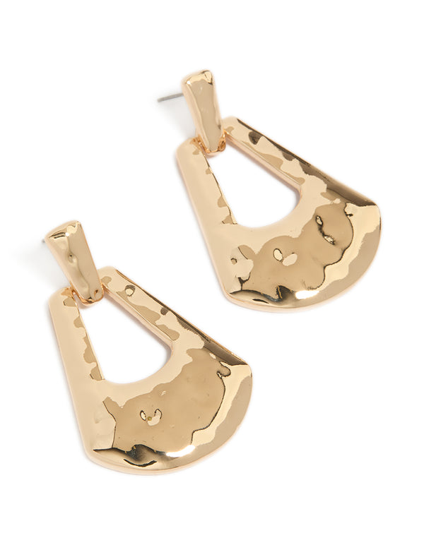 Featuring large barbell drop earrings in gold with statement style front view