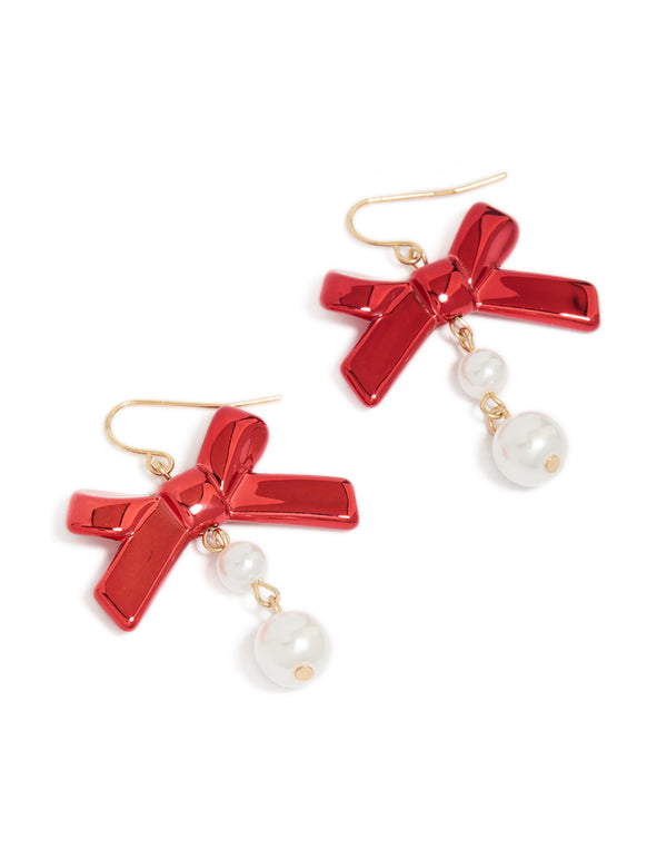 Elegant gold metallic red bow and pearl drop earrings featuring white accents front view
