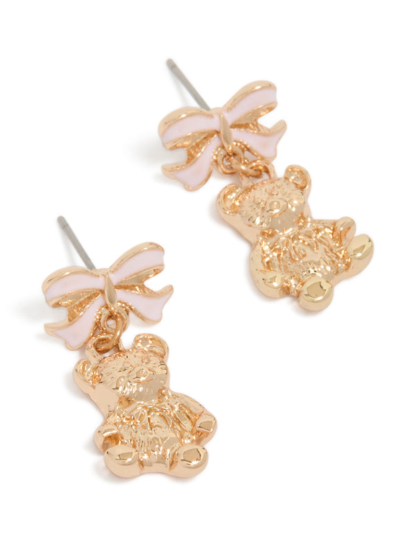 Showcasing gold light pink bow and bear drop earrings with animal features front view