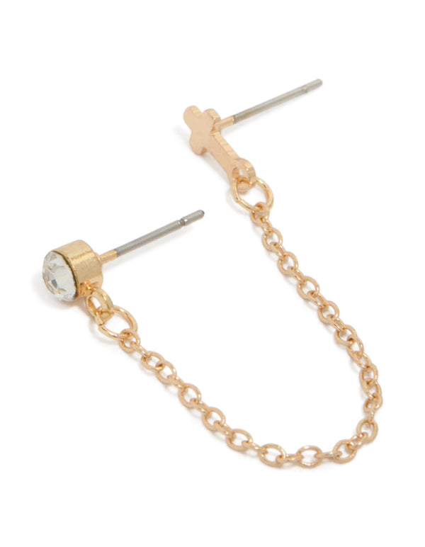 Showcasing gold diamante and cross stud earrings with chain connector in front view