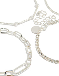 Displaying a silver diamante tennis and pearl bracelets 4-pack with charm accents in statement style close up view - link has visual effect only