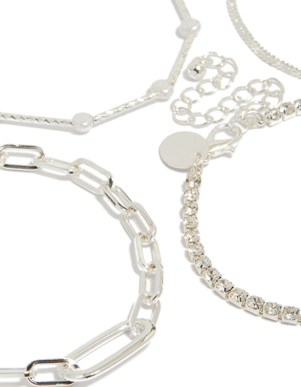 Displaying a silver diamante tennis and pearl bracelets 4-pack with charm accents in statement style close up view