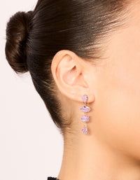 Elegant pink irregular stone drop earrings in gold featuring statement design on ear view - link has visual effect only