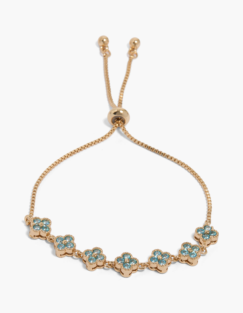 Showcasing a dainty toggle bracelet with light blue cubic zirconia floral in gold front view