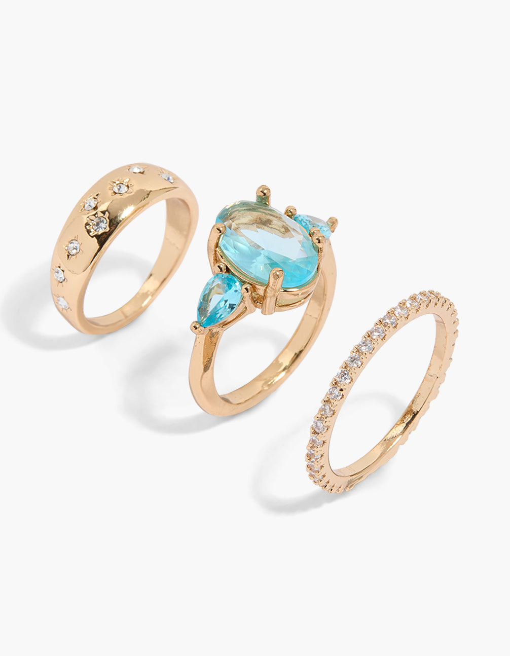 Discover this gold clear and aqua cubic zirconia ring 3-pack featuring oval stone cut front view