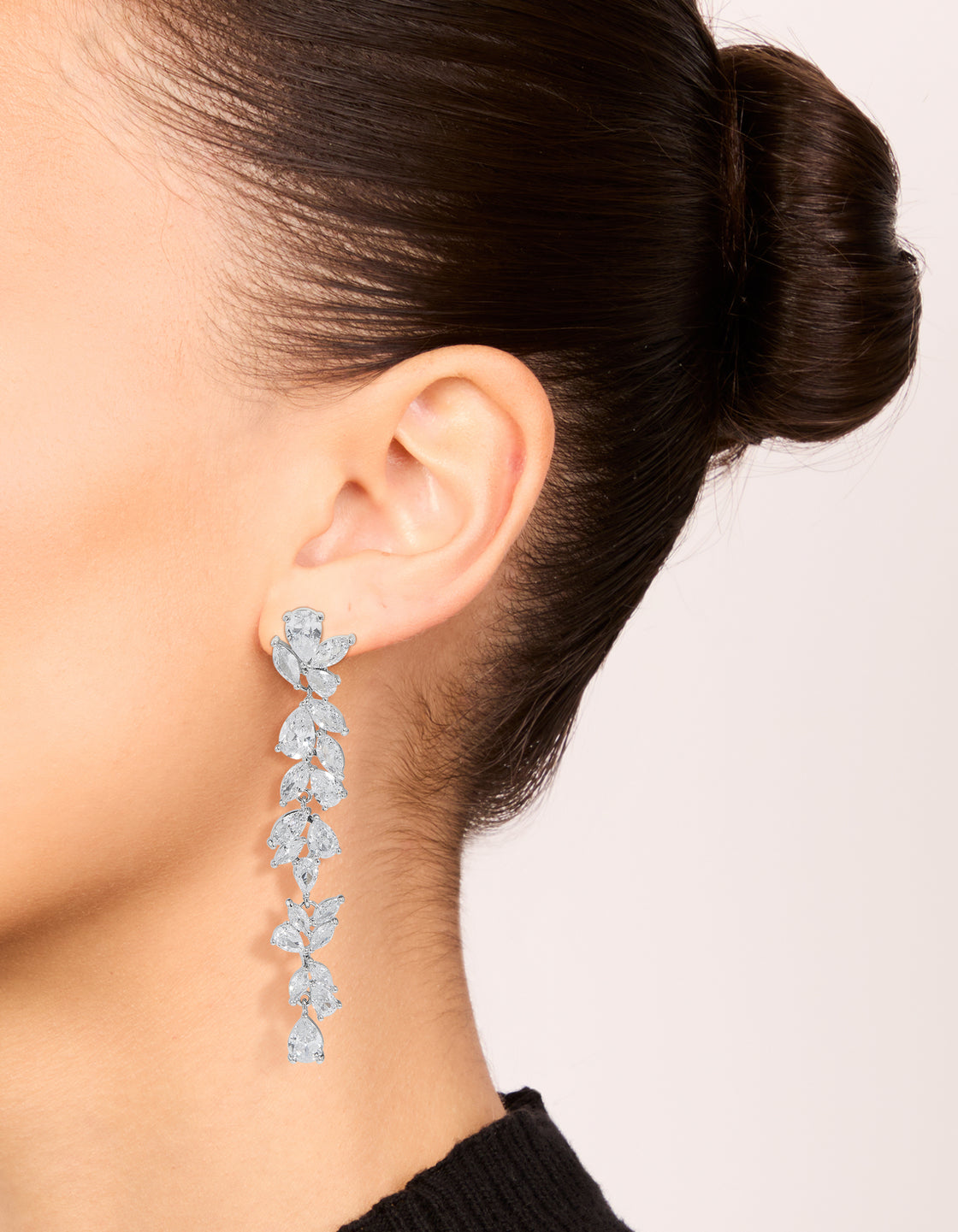 Elegant statement vine drop earrings and cubic zirconia in silver on ear view