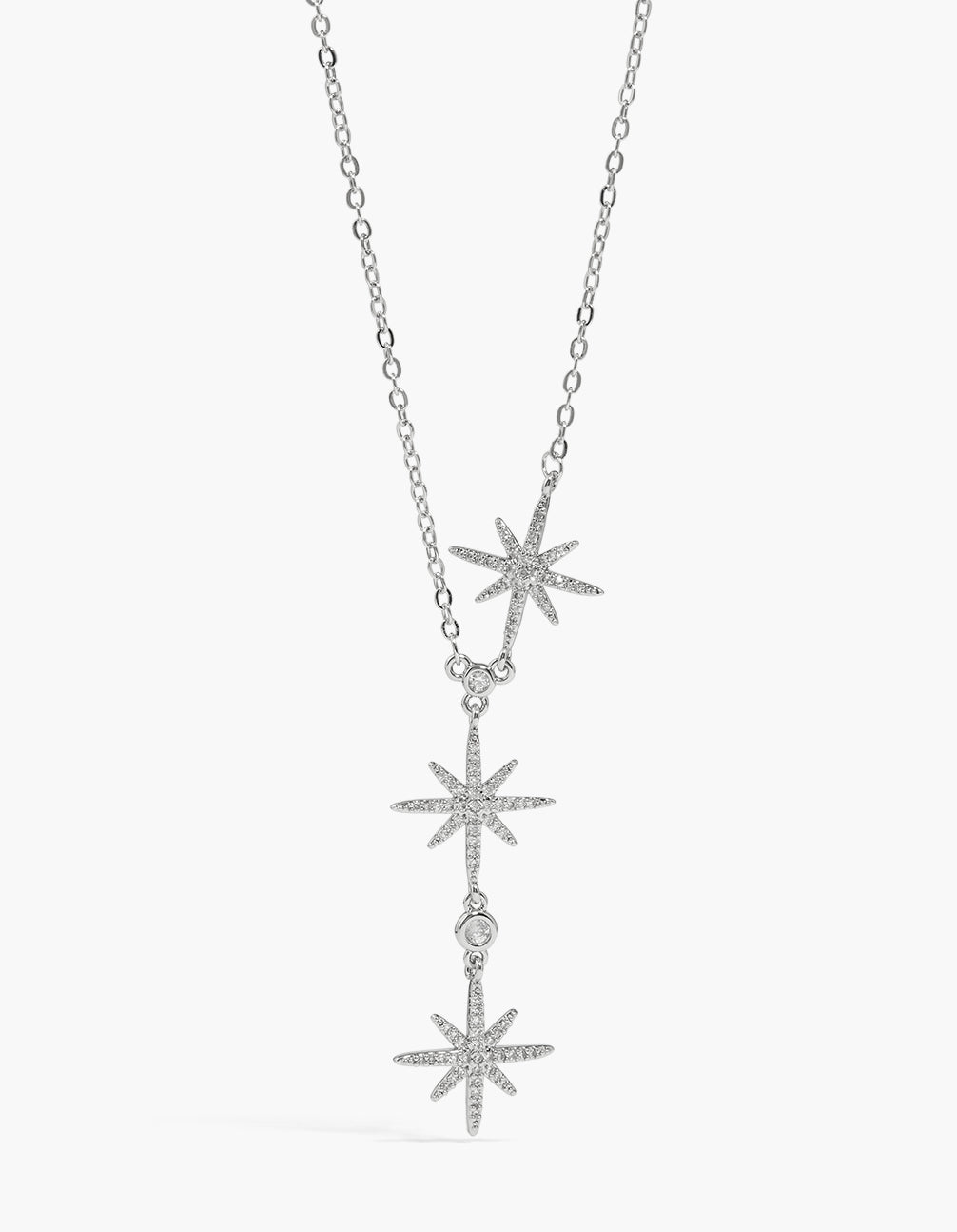 Discover this celestial charm featuring pavé stars trio pendant in silver with cubic zirconia and statement necklace front view