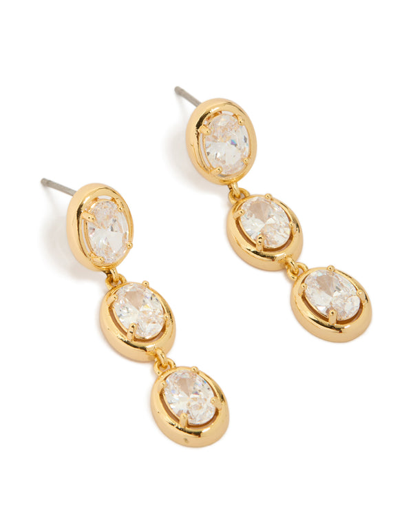 Elegant trio drop earrings featuring gold plated settings with oval cut cubic zirconia stones front view