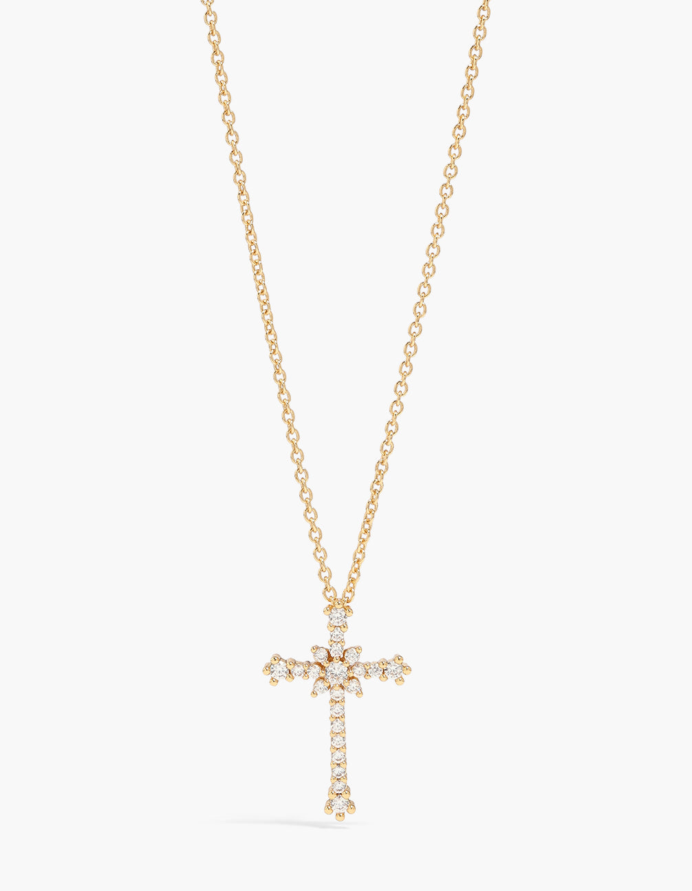 Showcasing a gold plated cubic zirconia cross pendant necklace close up view